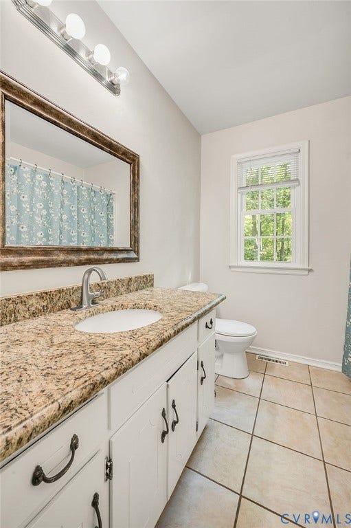 4820 Cedar Cliff Road, Chester, VA 23831 White vanity with an integrated sink, stone-finish countertop, and brushed nickel faucet