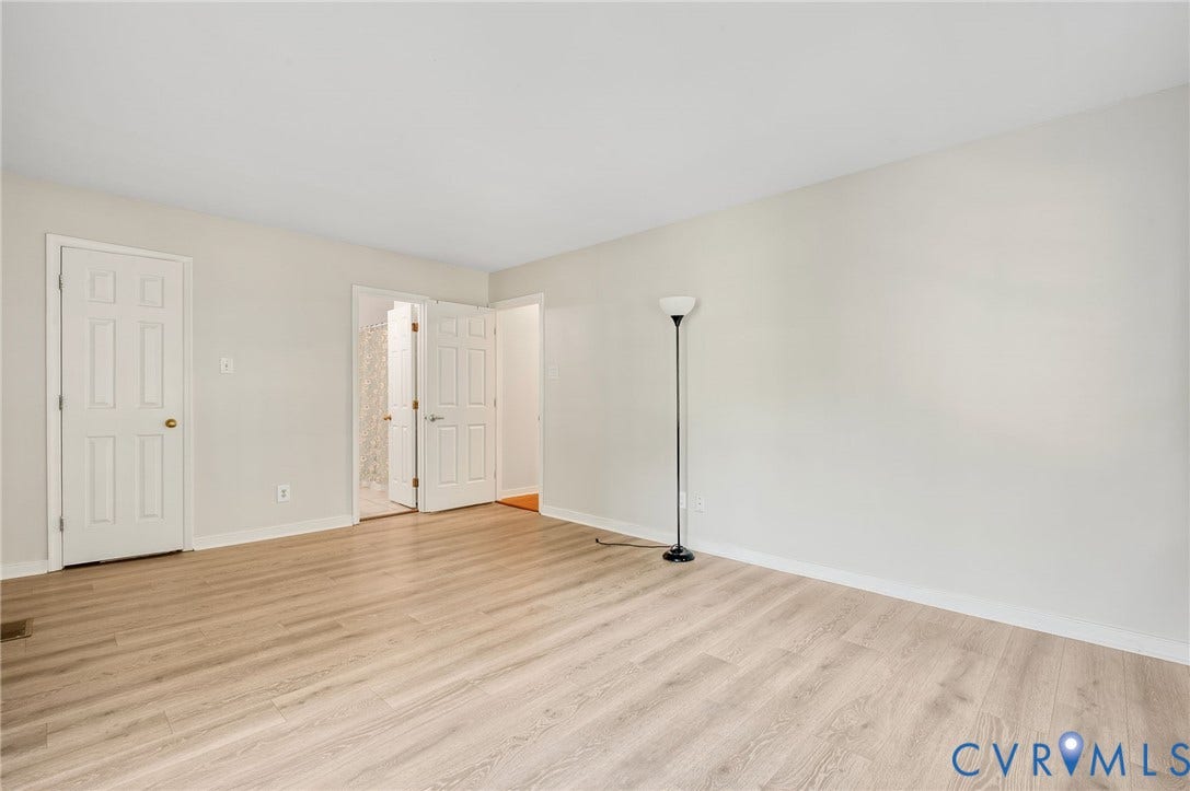 4820 Cedar Cliff Road, Chester, VA 23831 Neutral wall finishes, wood-finish flooring, and white trim