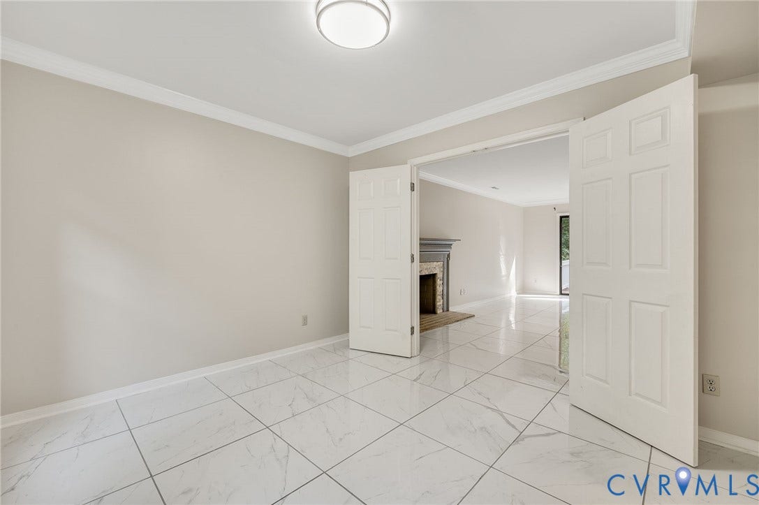 4820 Cedar Cliff Road, Chester, VA 23831 White tile flooring, crown molding, double paneled doors, and a flush mount ceiling light