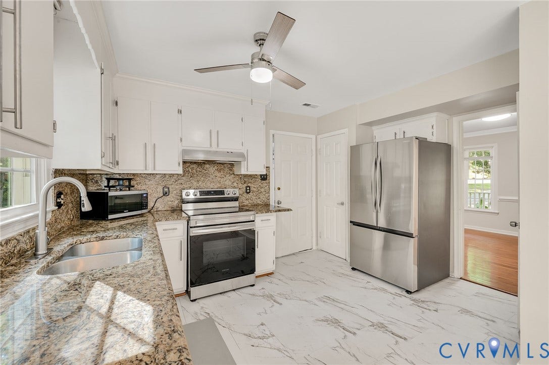 4820 Cedar Cliff Road, Chester, VA 23831 White cabinetry and granite countertops with a matching backsplash