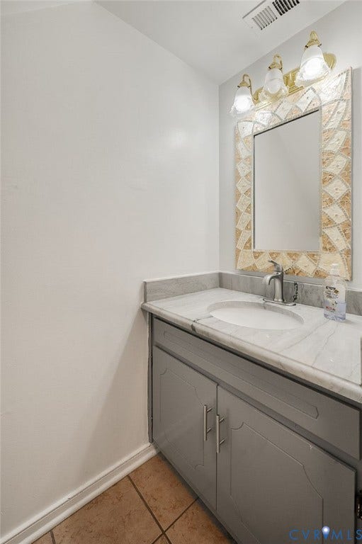 4820 Cedar Cliff Road, Chester, VA 23831 Bathroom vanity with a gray cabinet, countertop with integrated sink, and an ornate framed mirror