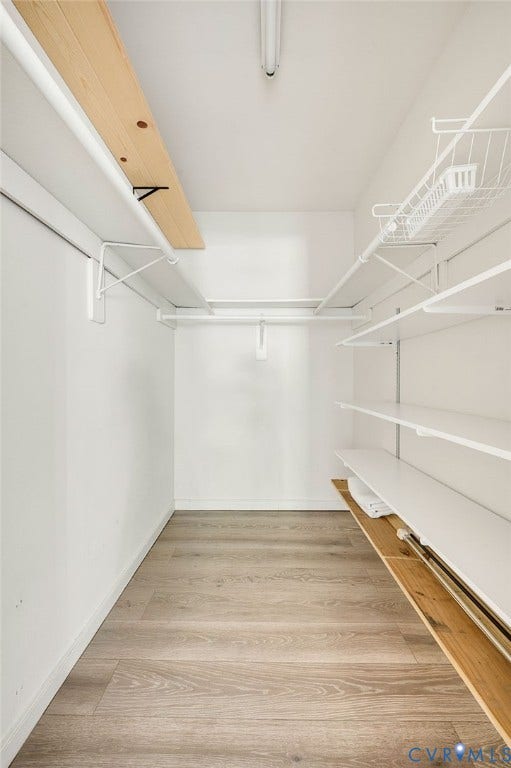 4820 Cedar Cliff Road, Chester, VA 23831 Wood-finish flooring, white walls, built-in shelving, white wire rack, and a ceiling-mounted light fixture