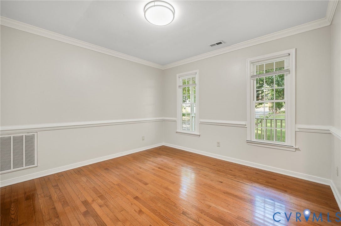 4820 Cedar Cliff Road, Chester, VA 23831 Hardwood flooring, crown molding, chair rail detailing, recessed lighting, and two windows
