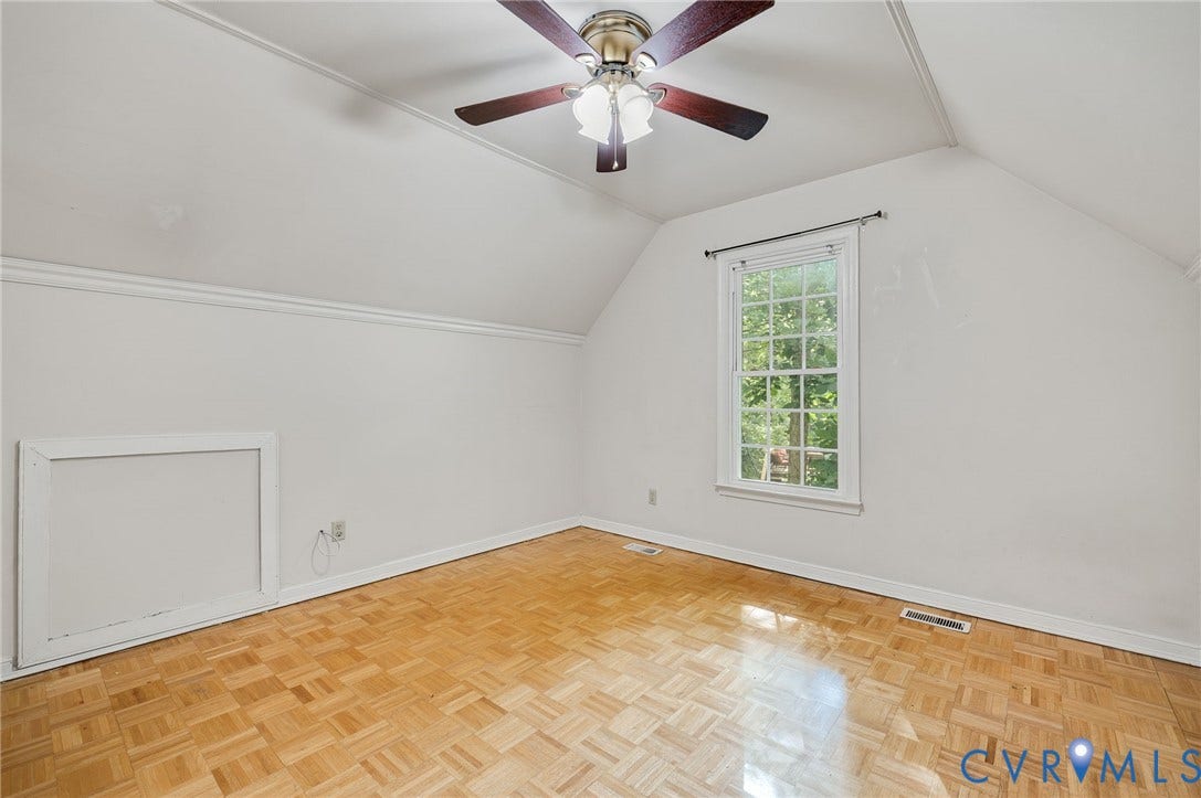 4820 Cedar Cliff Road, Chester, VA 23831 Parquet wood-finish flooring, sloped ceilings, a multi-pane window, crown molding, and a ceiling fan with integrated lighting