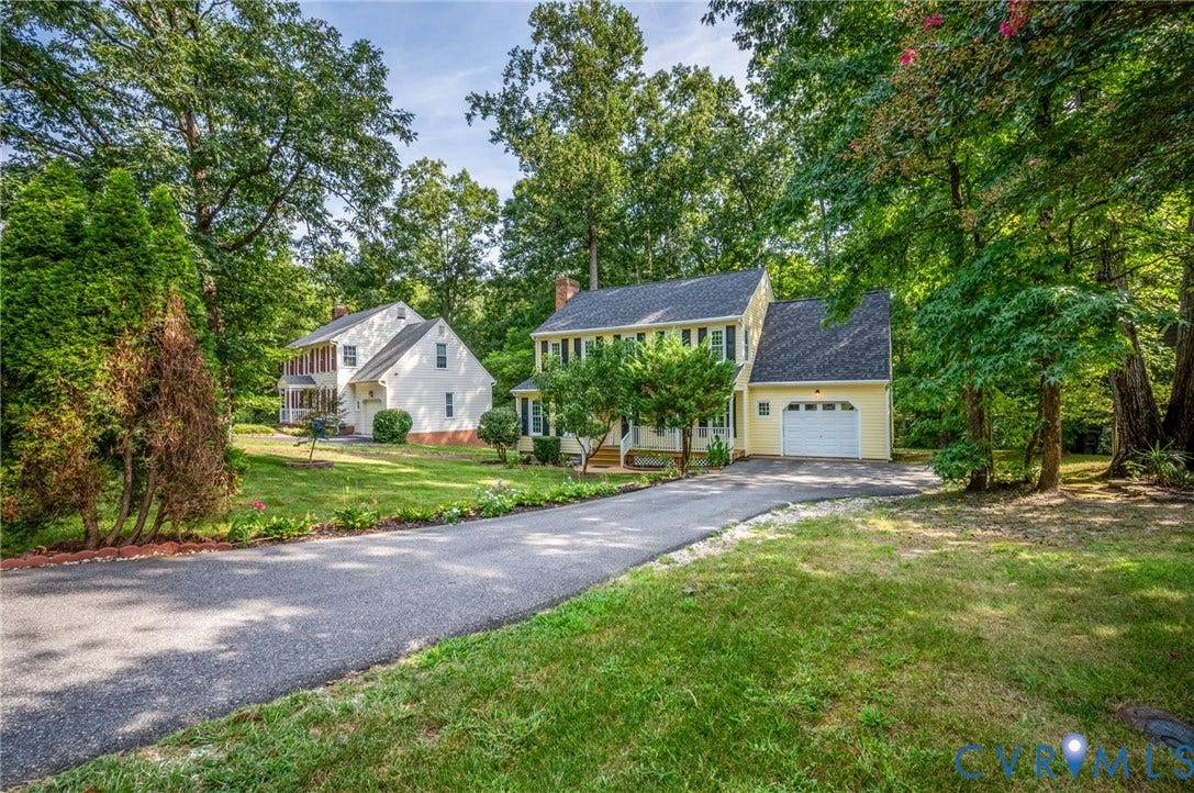 4820 Cedar Cliff Road, Chester, VA 23831 Colonial-style exterior with a paved driveway, attached garage, and mature landscaping
