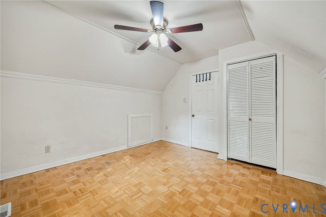 4820 Cedar Cliff Road, Chester, VA 23831 Vaulted ceiling with ceiling fan, wood-finish flooring, and white bi-fold louvered closet doors