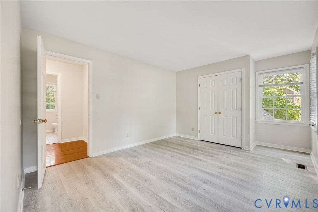4820 Cedar Cliff Road, Chester, VA 23831 Light wood-finish flooring with white baseboards