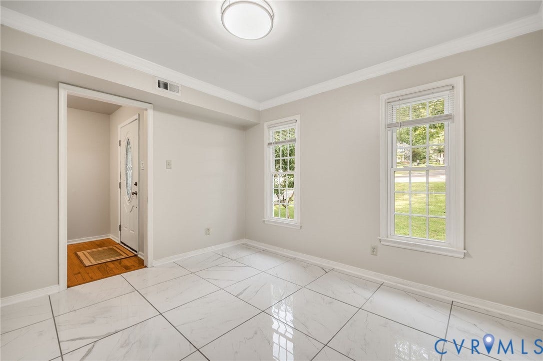 4820 Cedar Cliff Road, Chester, VA 23831 White tile flooring, dual windows with grilles, recessed ceiling light, crown molding, and a white entry door with decorative glass