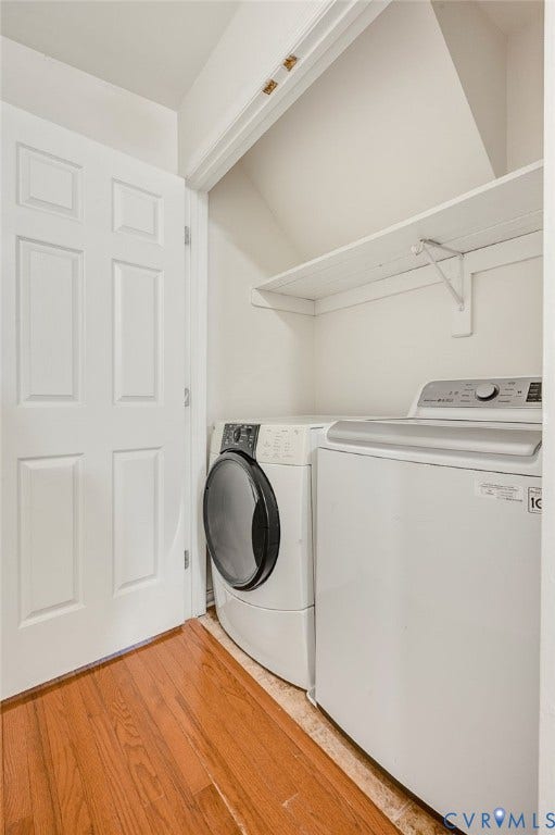 4820 Cedar Cliff Road, Chester, VA 23831 Integrated laundry area featuring wood-finish flooring, white paneled door, and built-in shelving