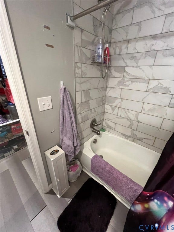 4202 Kempwood Court, Chesterfield, VA 23832 Bathtub with subway tile surround, brushed nickel fixtures, and wood-finish flooring