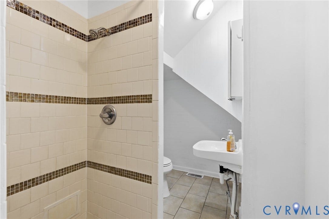 1202 1/2 W Clay Street, Richmond, VA 23220 Shower with off-white subway tile and mosaic accent bands