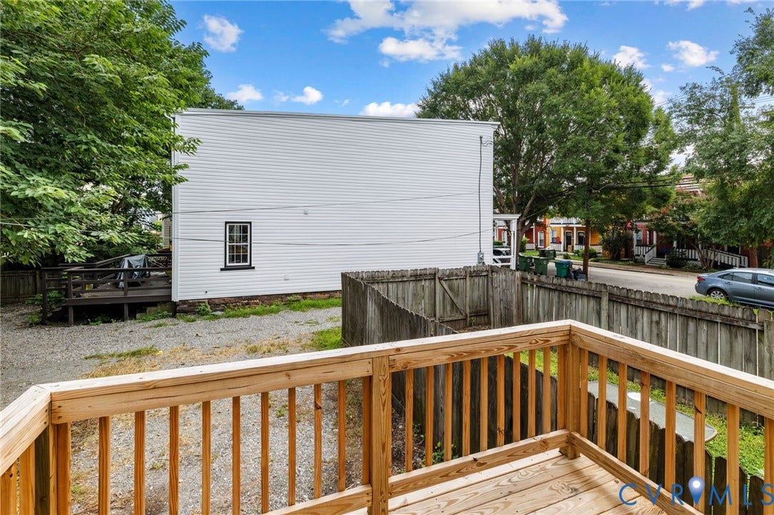 1202 1/2 W Clay Street, Richmond, VA 23220 Wood deck with a natural finish, wood fence, and gravel ground cover