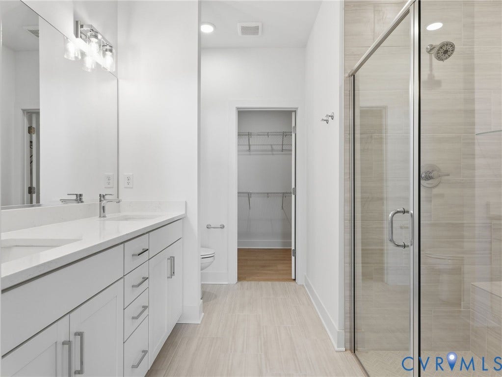 Primary Bathroom- Photo represents the actual home