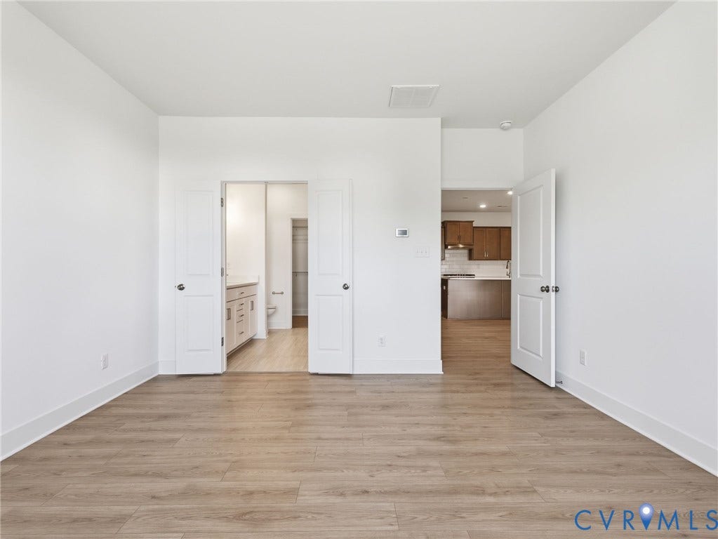 Primary Bedroom - Photo represents the actual home