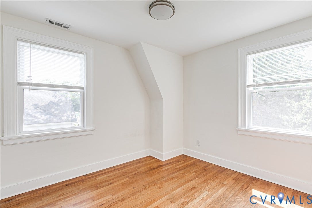 3215 Detroit Avenue, Richmond, VA 23222 Wood-finish flooring, white walls, two windows with blinds, and a ceiling-mounted light fixture