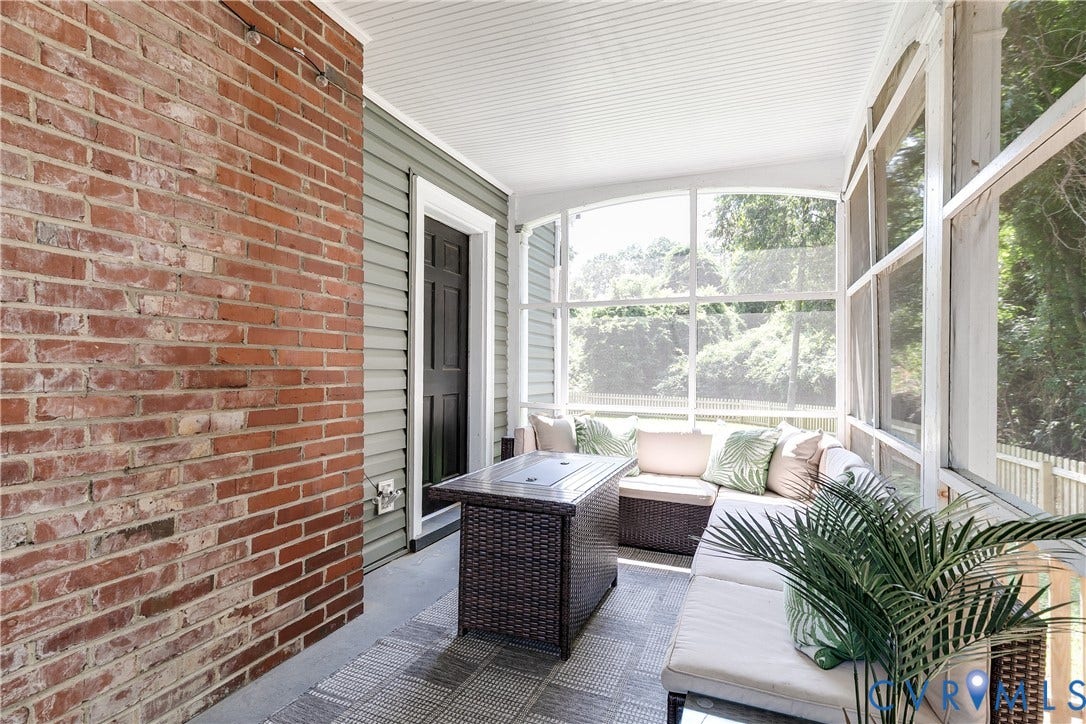 3215 Detroit Avenue, Richmond, VA 23222 Screened porch featuring a brick accent wall, beadboard ceiling, and gray siding