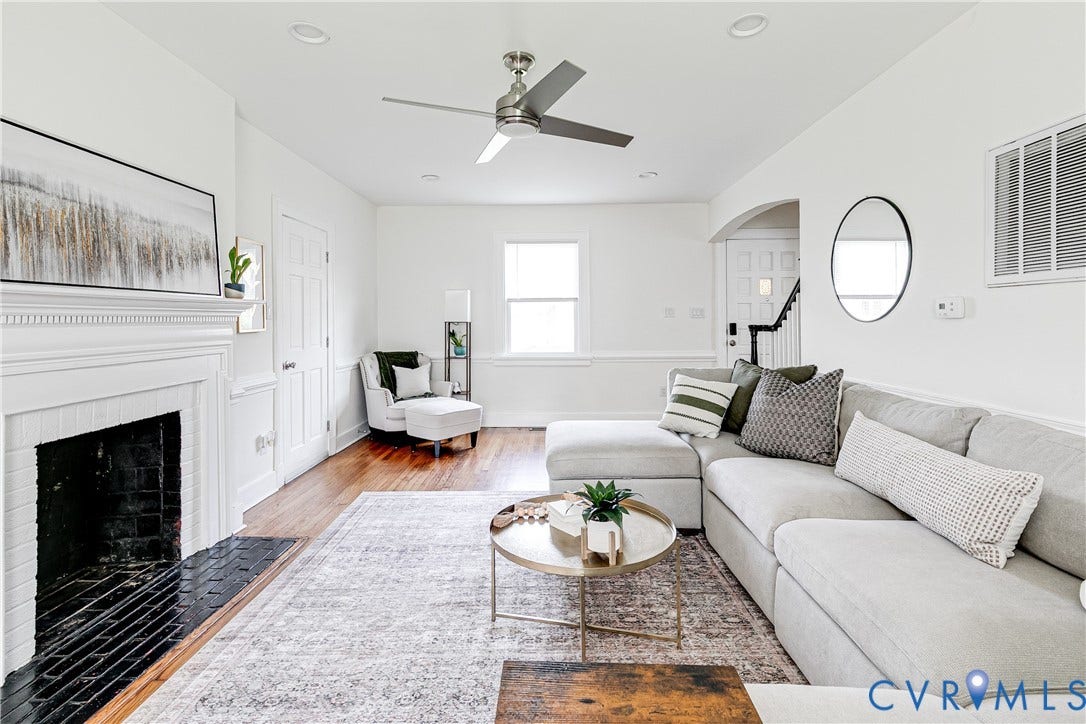 3215 Detroit Avenue, Richmond, VA 23222 Well-lit living area featuring wood-finish flooring, a white mantel, and an arched doorway