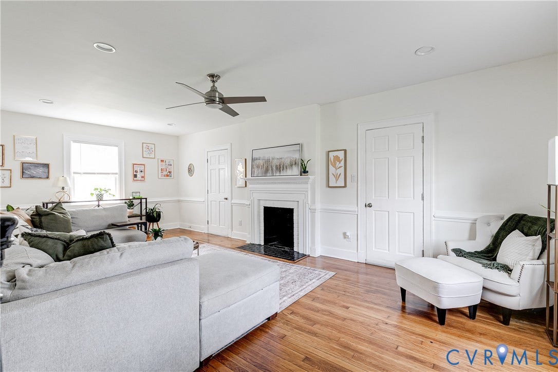 3215 Detroit Avenue, Richmond, VA 23222 Hardwood flooring, recessed lighting, ceiling fan, white paneled doors, and a fireplace with a mantel