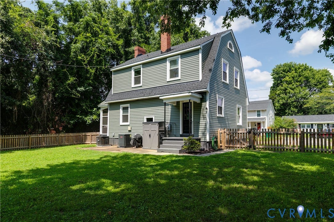 3215 Detroit Avenue, Richmond, VA 23222 Expansive lawn area with a fenced perimeter and a patio