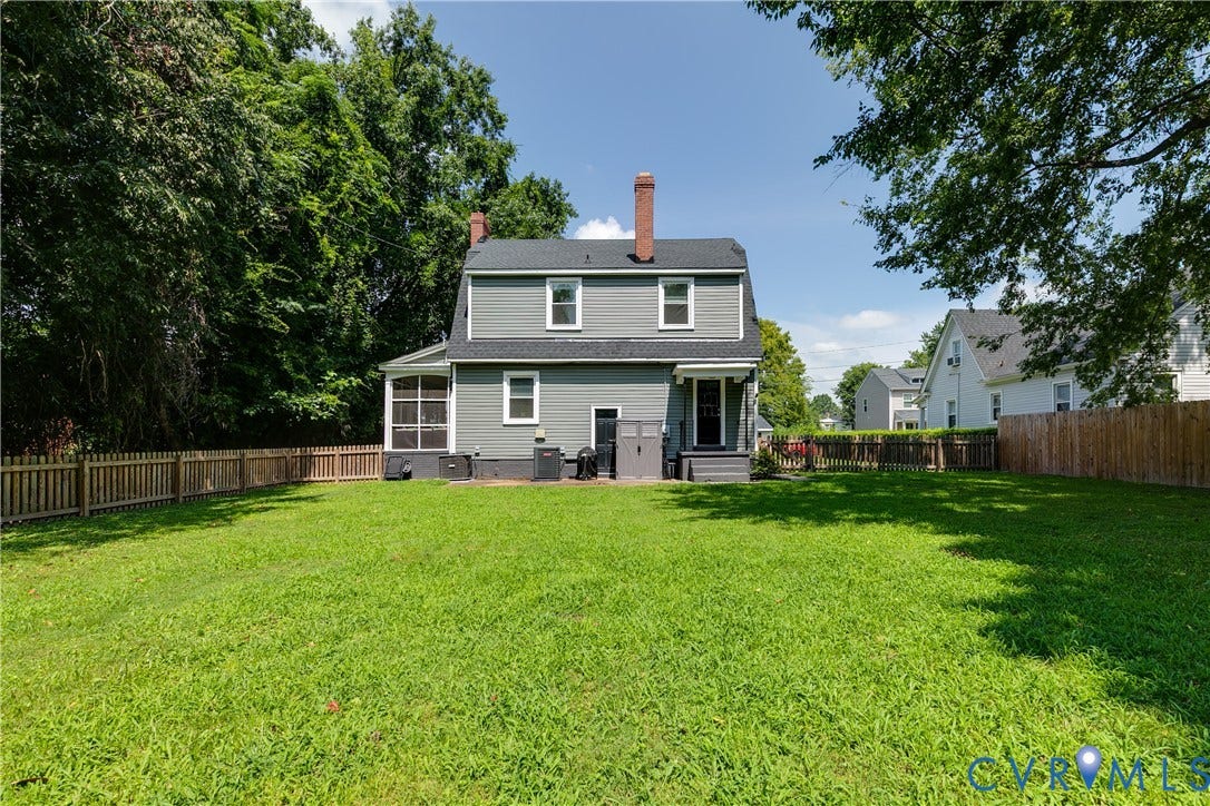 3215 Detroit Avenue, Richmond, VA 23222 Expansive fenced backyard featuring a screened porch, rear deck, and mature perimeter trees
