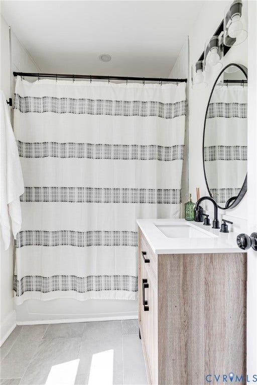 3215 Detroit Avenue, Richmond, VA 23222 Wood-finish vanity with a white countertop and rectangular undermount sink