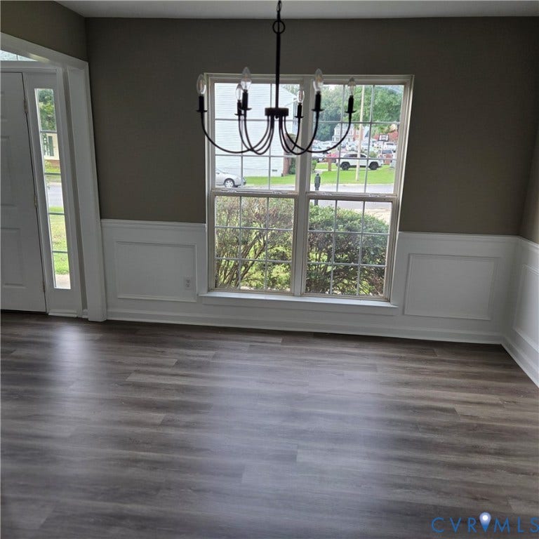 3241 Ransom Hills Road, Chesterfield, VA 23237 Wood-finish flooring, wainscoting, an overhead chandelier, and a multi-pane window