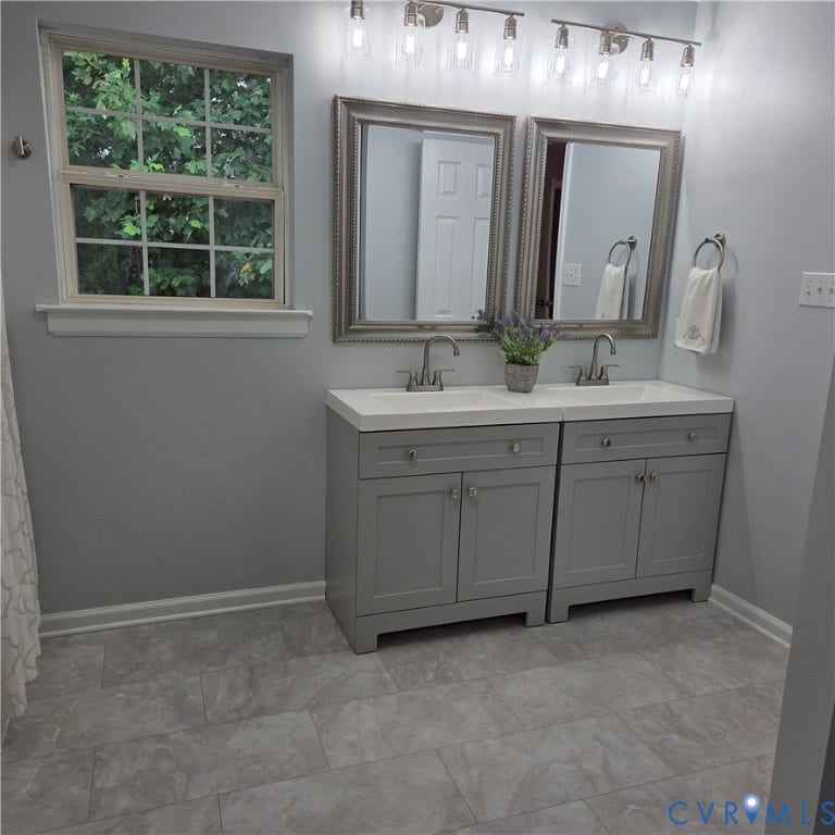 3241 Ransom Hills Road, Chesterfield, VA 23237 Dual vanity with white countertops, undermount sinks, and chrome faucets