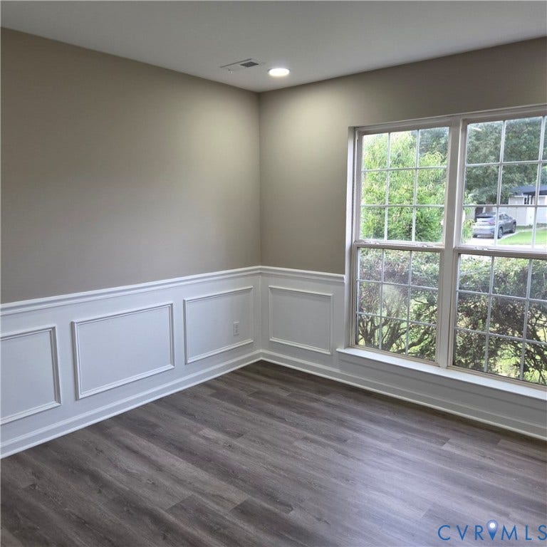 3241 Ransom Hills Road, Chesterfield, VA 23237 Recessed lighting, wood-finish flooring, accent wall paneling, large multi-pane window, and light-toned wall paint