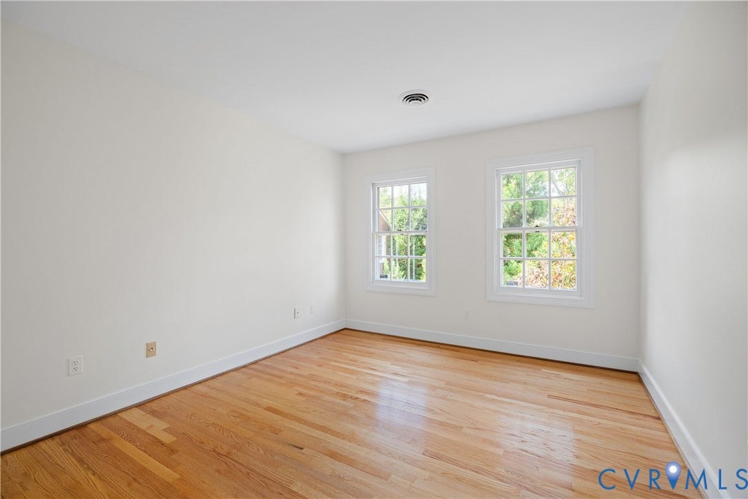 300 N Ridge Road, #97, Henrico, VA 23229 Bedroom three features hardwood floors and two rear windows.