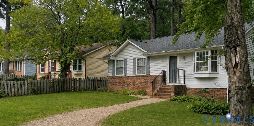 1043 Judson Road, Berkley Square, Richmond, VA 23225 White siding exterior with a brick foundation, featuring a bay window and a covered entry