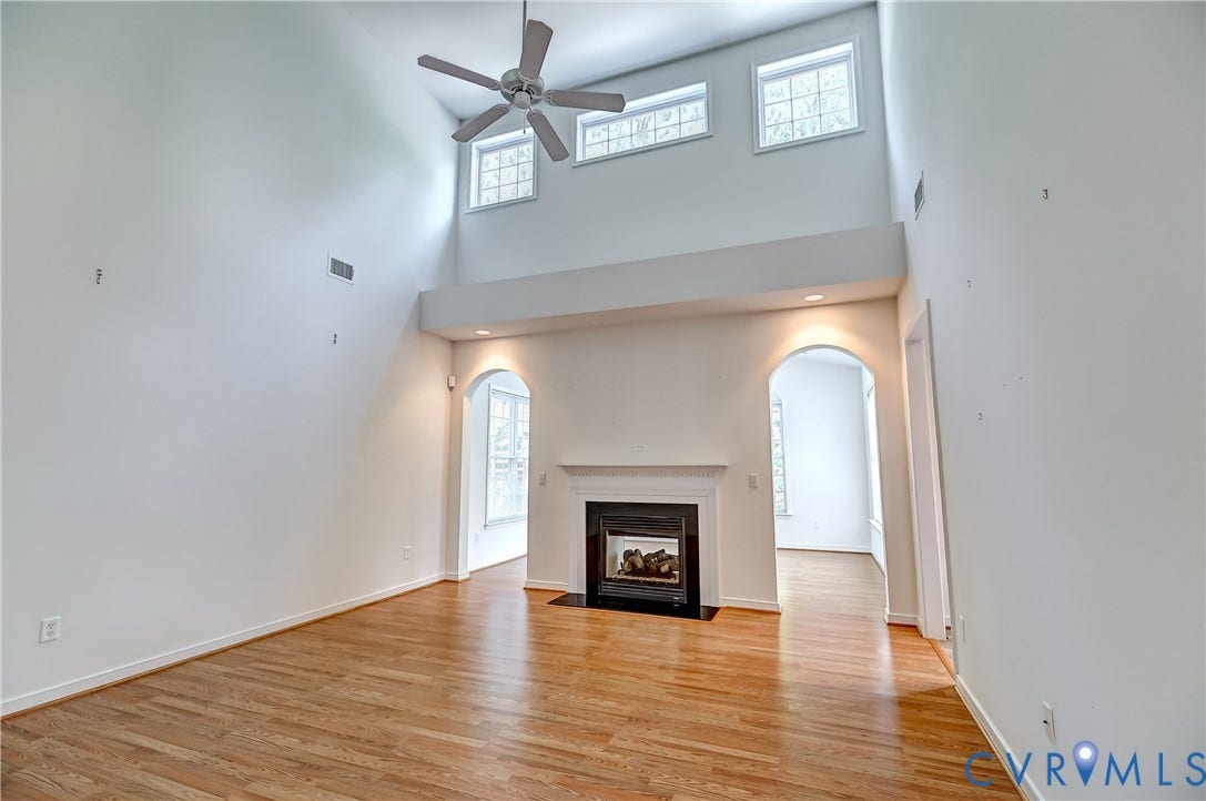 5046 Lewisetta Drive, Carriage Homes II Crossridge, Glen Allen, VA 23060 Hardwood-finish flooring, high ceilings, ceiling fan, arched doorways, and built-in fireplace with mantel