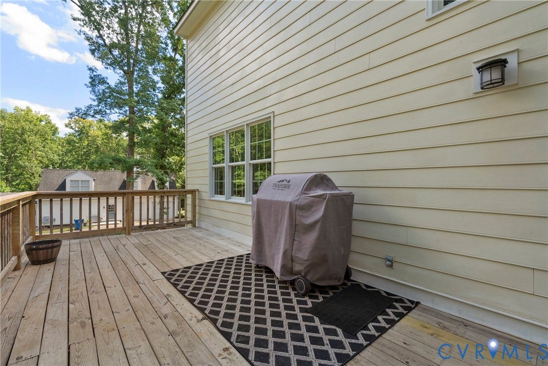 3242 Sherwood Ridge Drive, Powhatan, VA 23139 Expansive wood deck with a matching wood railing