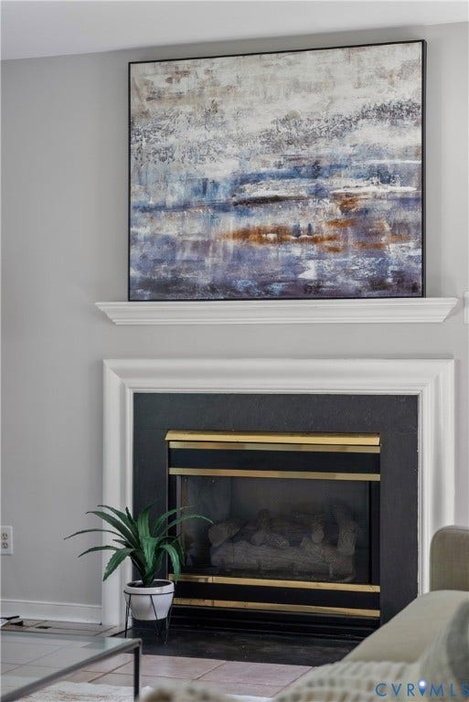 3242 Sherwood Ridge Drive, Powhatan, VA 23139 Fireplace featuring a black surround, a brass-framed firebox, and a white mantel