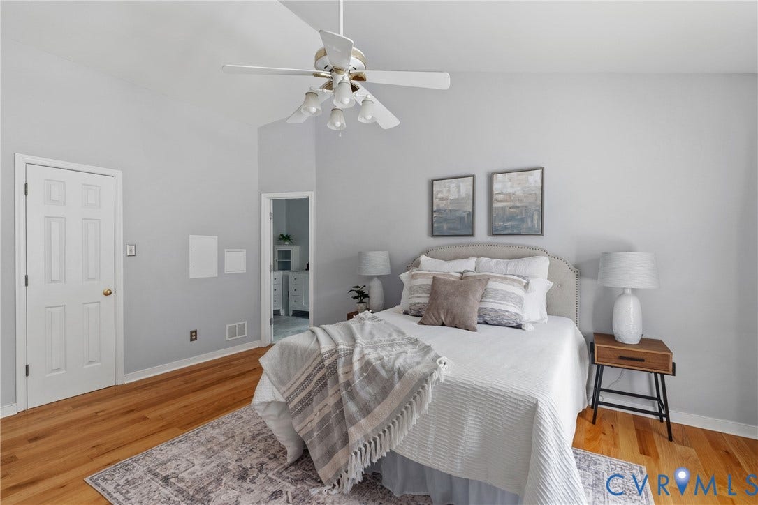 3242 Sherwood Ridge Drive, Powhatan, VA 23139 Vaulted ceiling with a ceiling fan, hardwood flooring, and a six-panel interior door