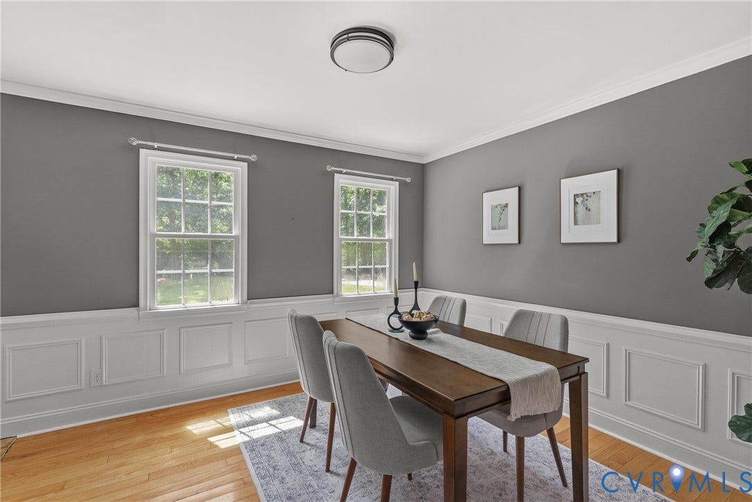 3242 Sherwood Ridge Drive, Powhatan, VA 23139 Wood-finish flooring, white panel molding, and two sash windows
