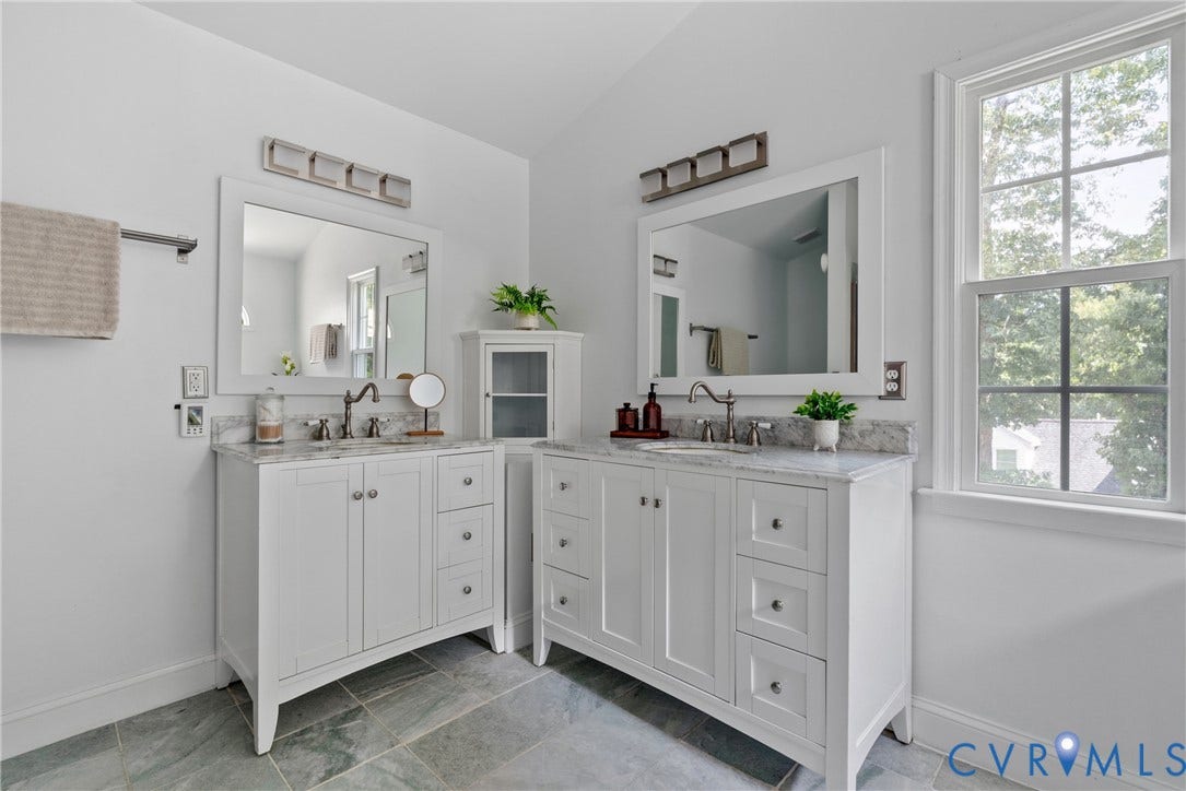 3242 Sherwood Ridge Drive, Powhatan, VA 23139 Dual white vanities with marble-finish countertops, undermount sinks, and wall-mounted mirrors