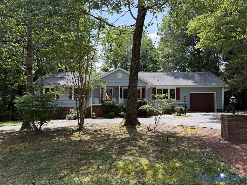 4603 Edenton Place, Greenbriar, Chester, VA 23831 Light blue siding exterior with a covered front porch featuring white railings