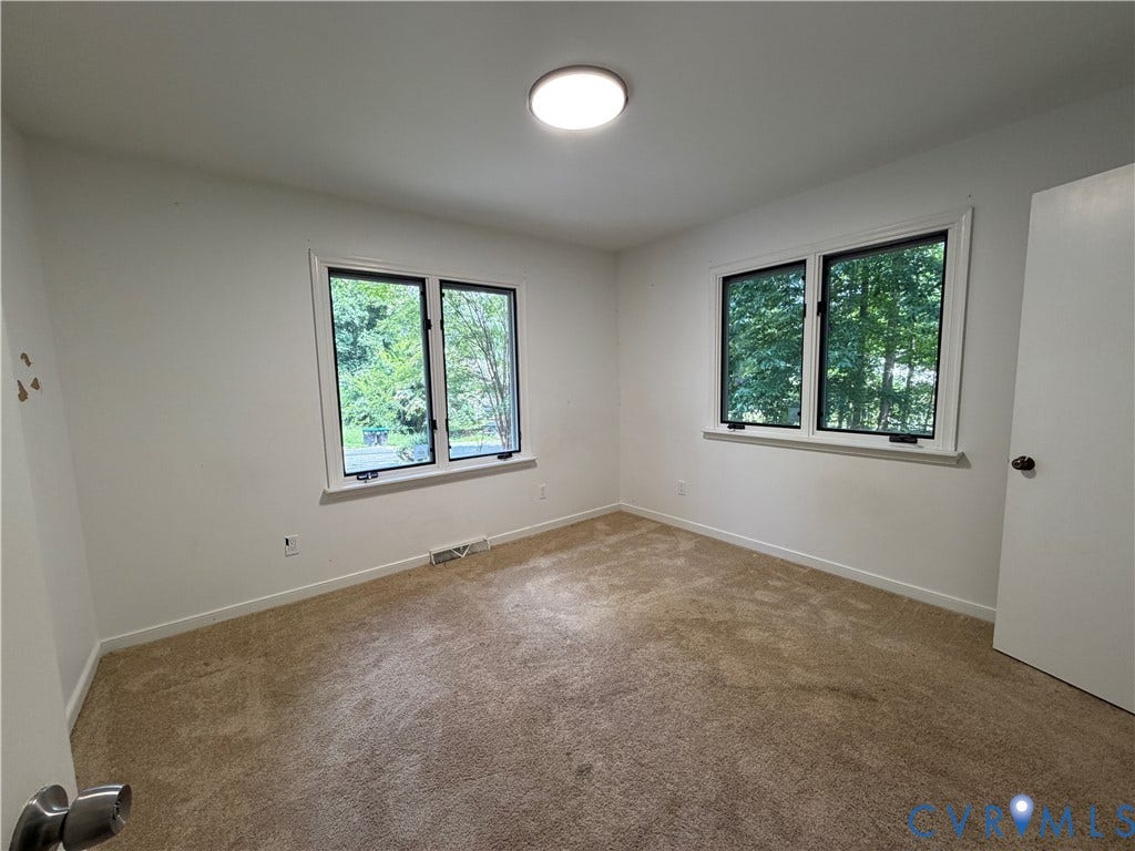4603 Edenton Place, Greenbriar, Chester, VA 23831 Neutral-toned carpeting, white walls, and a contemporary flush-mount ceiling light