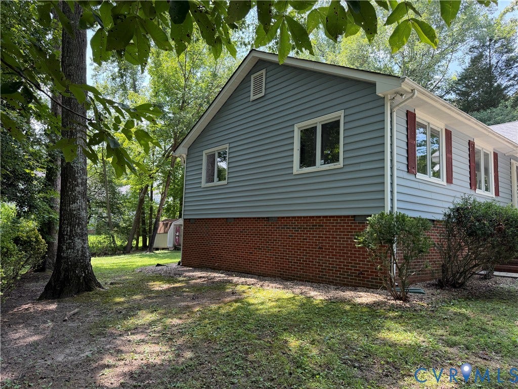 4603 Edenton Place, Greenbriar, Chester, VA 23831 Exterior featuring light blue siding, a brick foundation, and multiple windows with red shutters