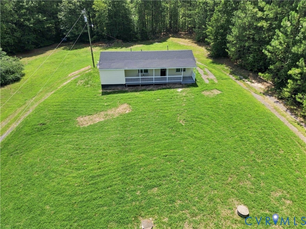 16111 Walkers Mill Road, Stony Creek, VA 23832 White siding exterior with a dark roof and a front porch