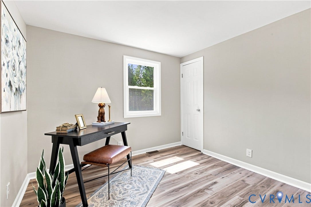 16111 Walkers Mill Road, Stony Creek, VA 23832 Light gray walls, wood-finish flooring, white trim, and a white window frame
