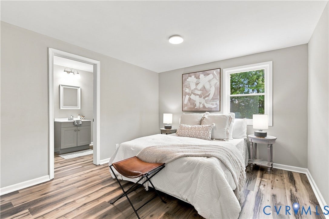 16111 Walkers Mill Road, Stony Creek, VA 23832 Wood-finish flooring throughout, light gray wall paint, and a single window