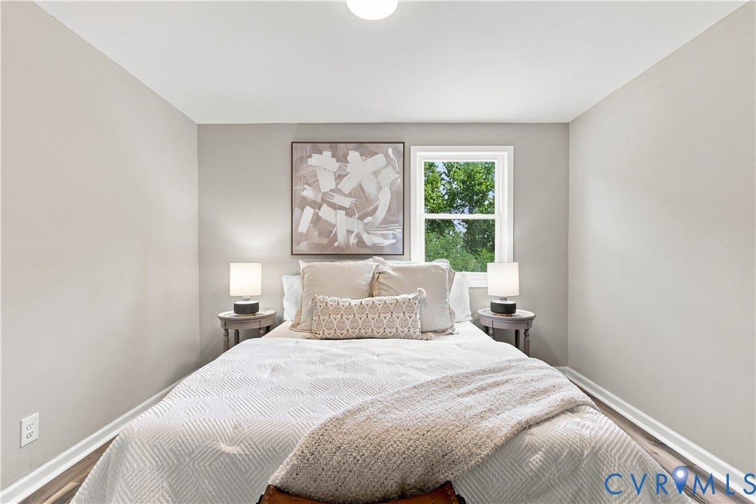 16111 Walkers Mill Road, Stony Creek, VA 23832 Neutral wall color, wood-finish flooring, white trim, and a window for natural light