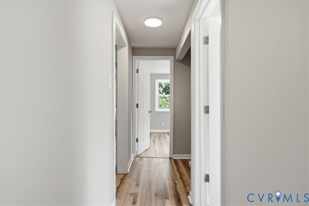 16111 Walkers Mill Road, Stony Creek, VA 23832 Hallway featuring wood-finish flooring, white trim, and a recessed ceiling light