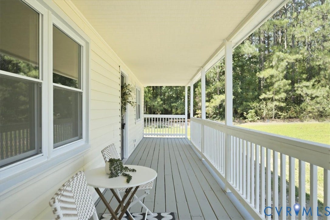 16111 Walkers Mill Road, Stony Creek, VA 23832 Expansive covered porch featuring a painted wood floor, white railing, and multiple windows with screens