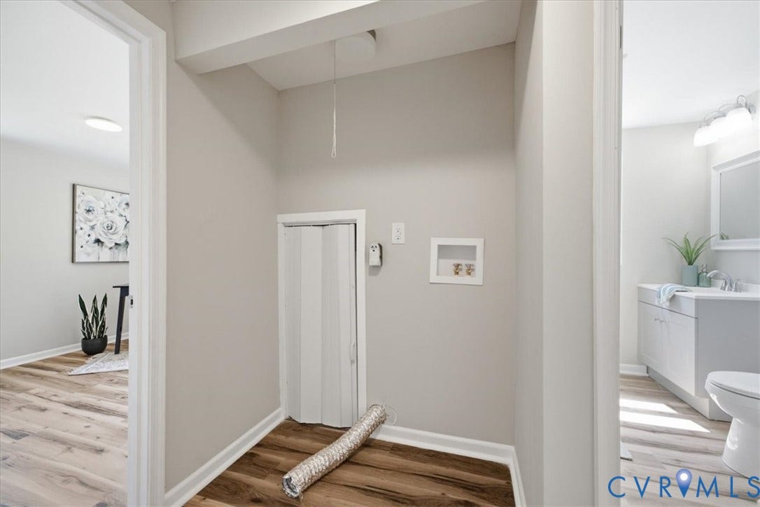 16111 Walkers Mill Road, Stony Creek, VA 23832 Dedicated laundry area featuring wood-finish flooring and neutral wall tones