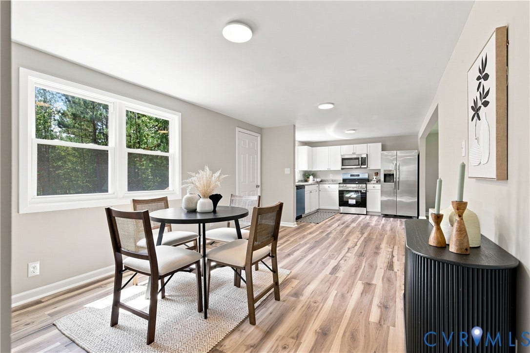16111 Walkers Mill Road, Stony Creek, VA 23832 Open-concept living space featuring wood-finish flooring, recessed lighting, and a kitchen with white cabinetry and stainless steel appliances