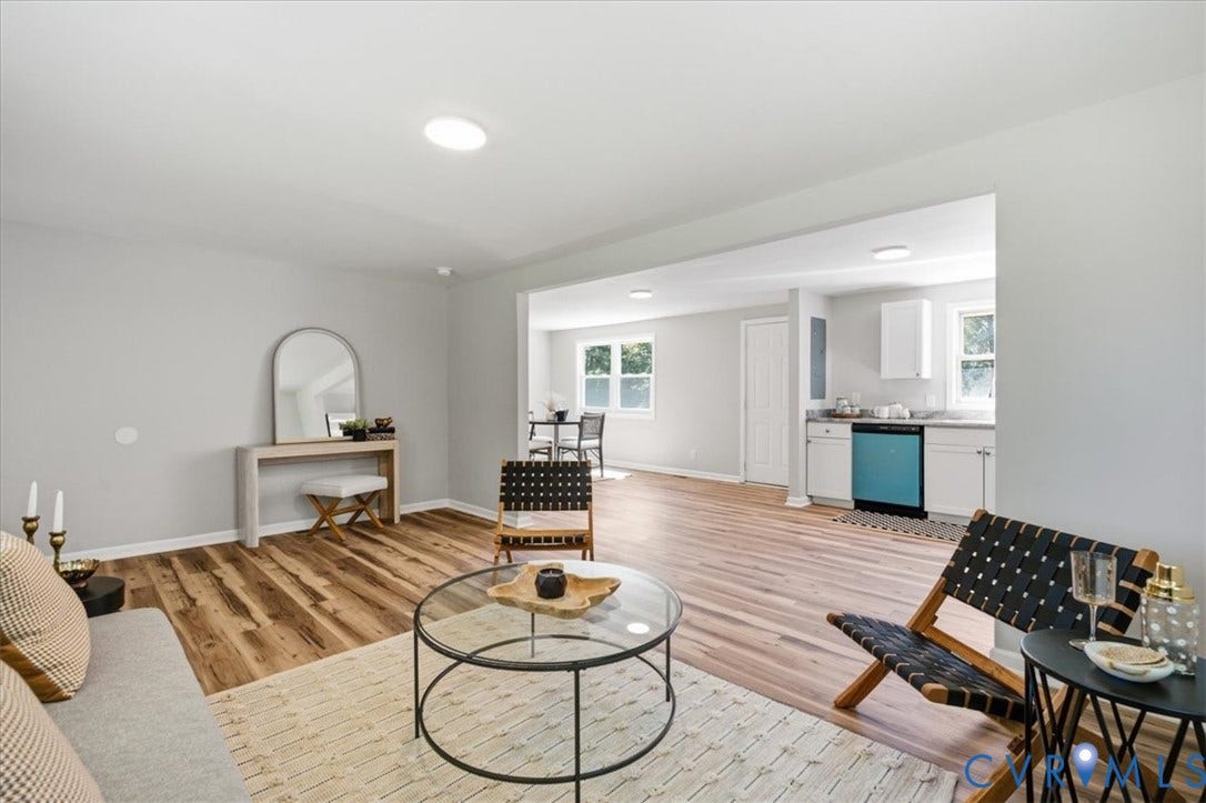 16111 Walkers Mill Road, Stony Creek, VA 23832 Open-concept living area featuring wood-finish flooring, recessed lighting, and a bright kitchen with white cabinetry and a blue dishwasher