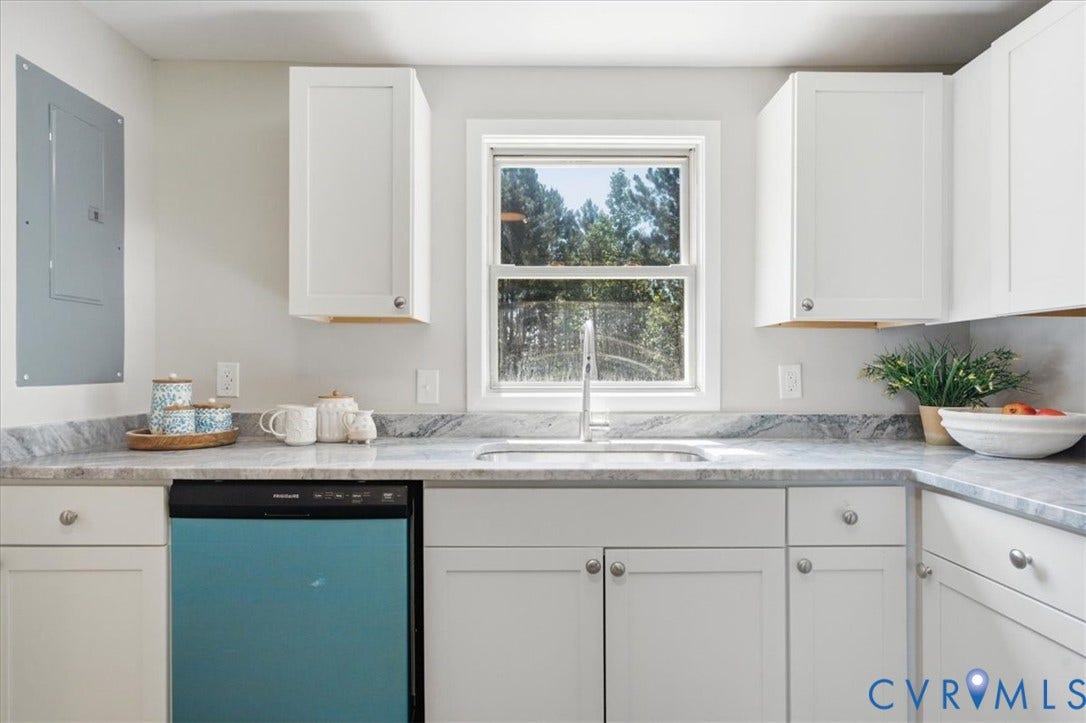 16111 Walkers Mill Road, Stony Creek, VA 23832 White shaker-style cabinetry with knob hardware, gray patterned countertops, stainless steel sink with a gooseneck faucet, and a built-in dishwasher