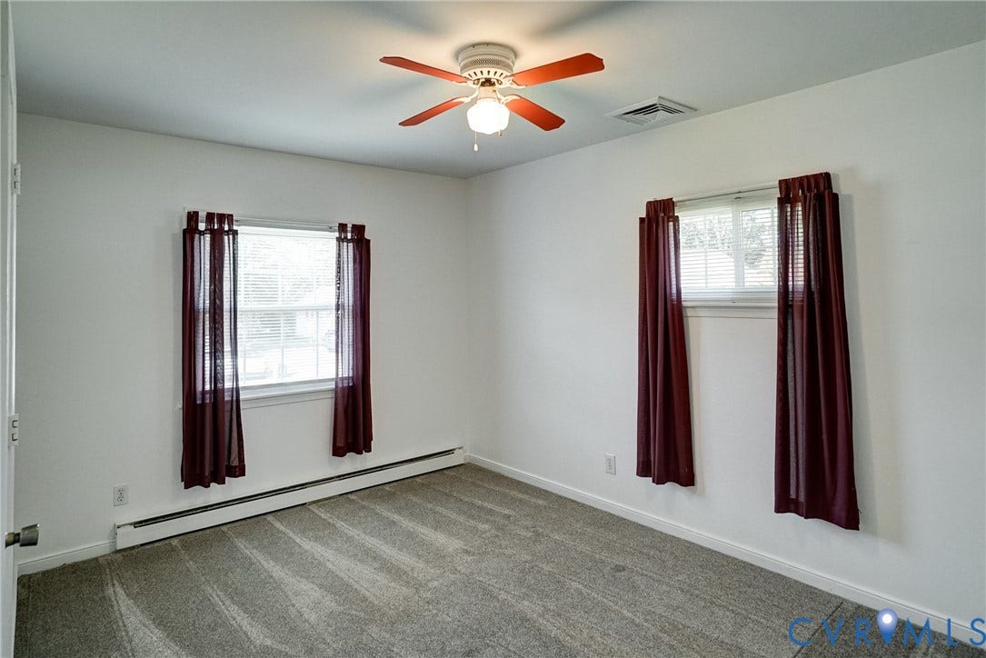 10104 Terry Court, Henrico, VA 23228 Carpeted flooring, white walls, two windows, and a ceiling fan with light fixture